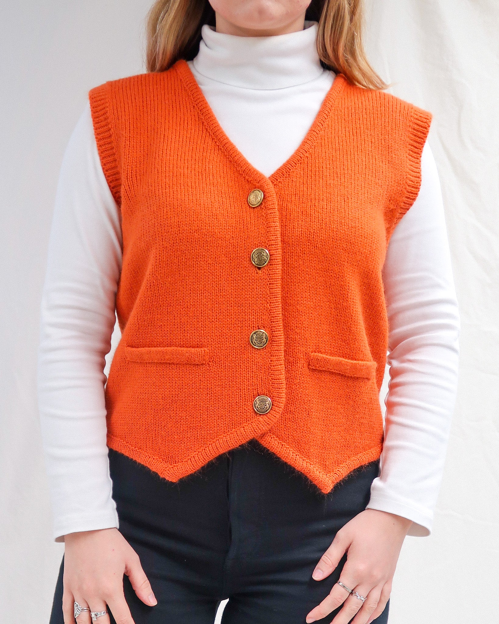 Orange sweater vest