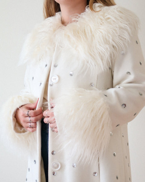 White faux fur coat